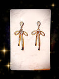 Gold tone bow earrings with blue Australian crystal centers