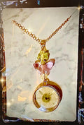 Delicate dried flower pendant with butterfly and flower glass beads. Handmade, necklace included
