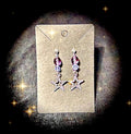 Silver glitter star earrings with shades of purple glass beads