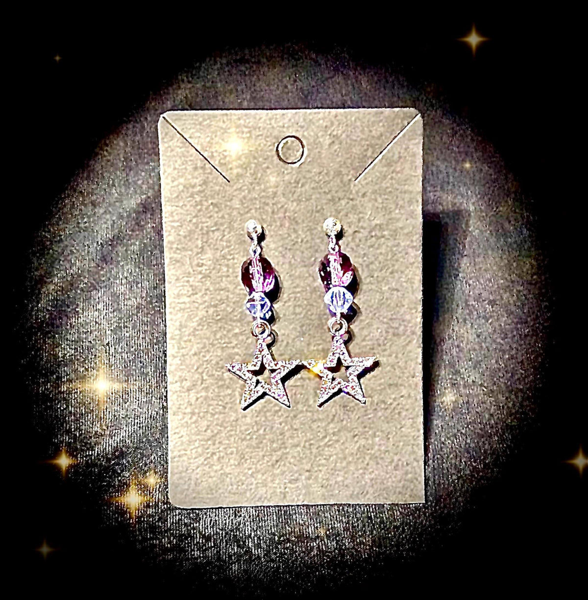 Silver glitter star earrings with shades of purple glass beads
