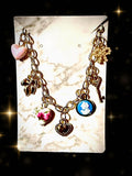 Cameo, hearts, bows gold tone charm bracelet