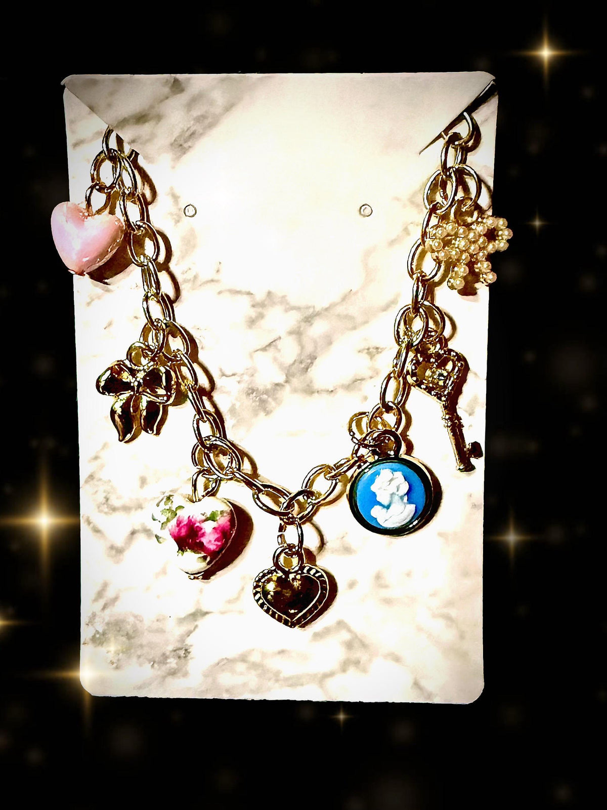 Cameo, hearts, bows gold tone charm bracelet